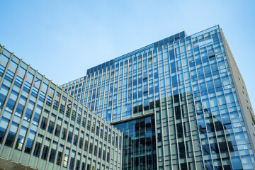 Fototapeta premium Looking Up Blue Modern Office Building