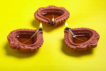 happy diwali or happy deepavali greeting card made using a photograph of diya or oil lamp