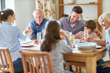 Happy extended family having lunch