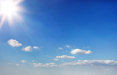 Blue sky with white clouds and sunshine