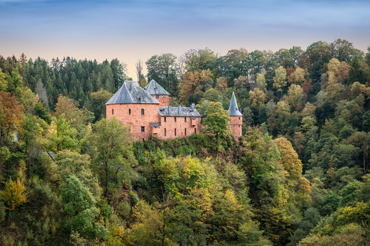 Medieval castle in the green wooded nature of the Belgian Ardennes. Reinhardstein Castle, Ovifat, Belgium.