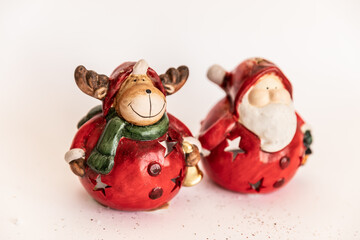 Christmas. New Year's jewelry. toy santa claus and deer on a white background.