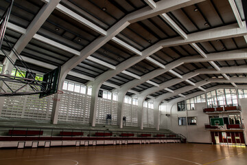 Empty basketball gym. Interior of a basketball hall. Copy space, Selective focus.