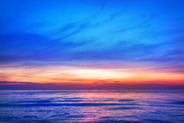 Obraz na płótnie Canvas Beautiful pink sunset, blue sky, purple sea background, blurred watercolor sunrise, quiet ocean beach landscape, peaceful morning seascape, idyllic dawn nature, calm soft dusk & gentle sun light glow