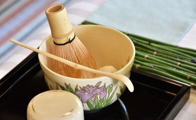 A cup of the Japanese tea ceremony and tea set to mix it