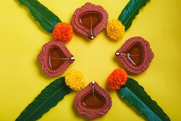 happy diwali or happy deepavali greeting card made using a photograph of diya or oil lamp