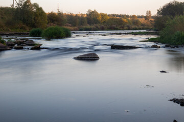 A photo of a small river in Russia, taken on a long exposure.