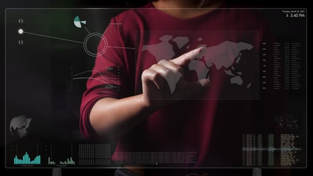 Upper body view of woman working on a futuristic digital touch screen against a black background. World map, Data, graphs, diagrams on hologram monitor. Animation overlay hud