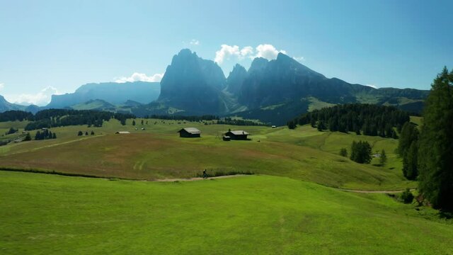Man speeds down Alpine trail on Bike, Dolomites, Italy