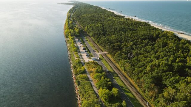 Aerial slow motion drone shot Hel Peninsula, road between Sea Baltic and Gulf of Gdansk, cinematic footage