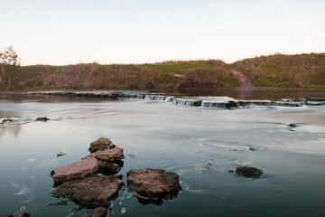 A photo of a small river in Russia, taken on a long exposure.