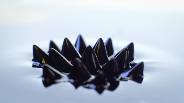 Pulsating Ferrofluid moving as magnetic forces change its shape. Dark and arty. 4K resolution. Slow motion. High quality 4k footage