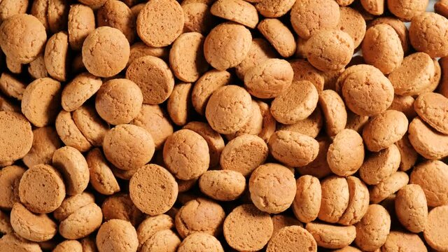 Background for Dutch holiday Sinterklaas with rotation kruidnoten, traditional sweets, strooigoed. St. Nicolas day concept. 4K video, 50 fps