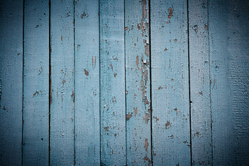 Natural wood background with cracked blue paint