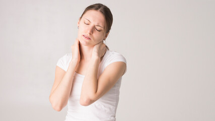 Fototapeta premium Tired woman feeling pain, massaging tense muscles