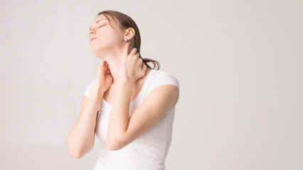 Fototapeta premium Tired woman feeling pain, massaging tense muscles