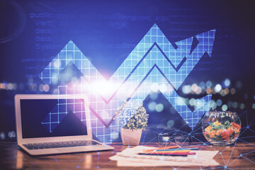 Computer on desktop with point up arrows hologram. Double exposure. Concept of success.