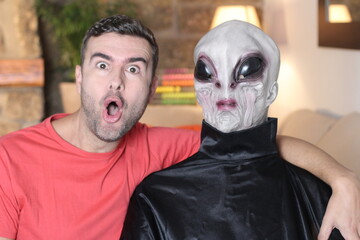 Shocked man meeting an alien 