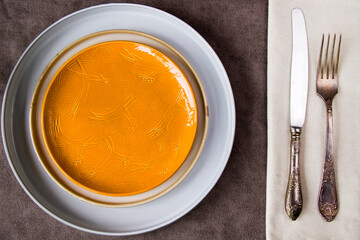 Empty tableware and dishware settings and serving on the gray background