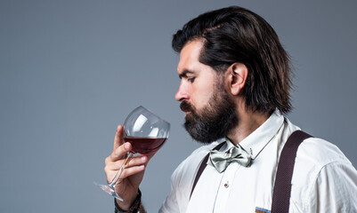 Alcohol use is life abuse. handsome hipster drinking wine glass. sommelier tasting alcohol. bearded...