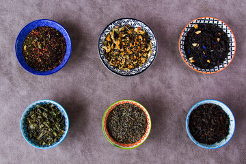 Herbal and dry tea set, variation and collection of tea in bowls