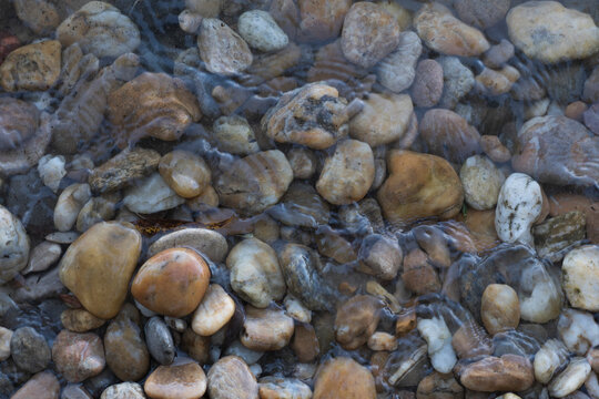 Stones on the beach Danube river Bratislava, Decorative stone wallpaper with nature texture