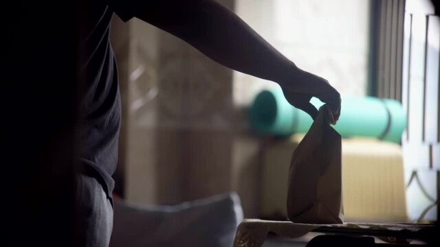 spraying sanitizer small spray on pakage food slow motion