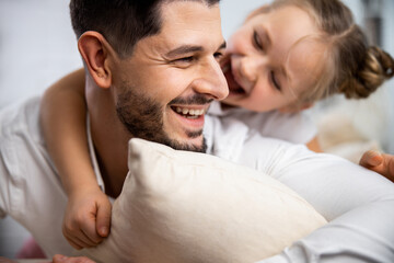 Fototapeta premium Dad and daughter looking at each other