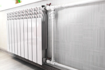 Central heating radiator on the wall in the room