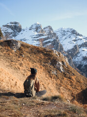 Relaxing in the mountains girl with rucksack 