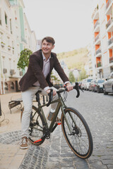 Full length shot of a cheerful mature businessman crossing the street on his bike