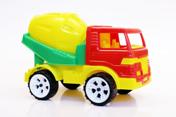 Concrete mixer toy isolated on white background 