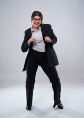 Cheerful businesswoman dancing