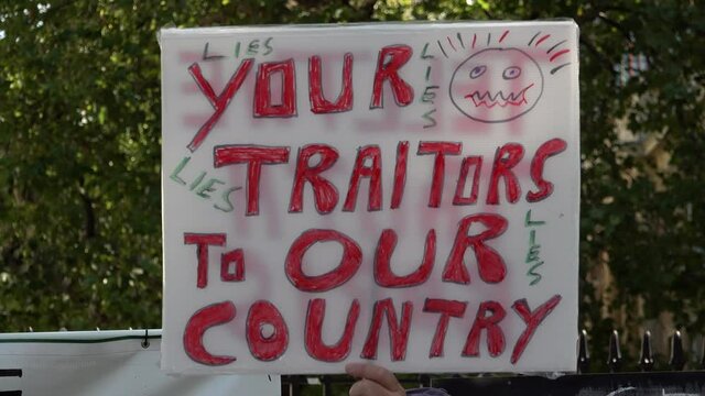 A misspelt handmade placard is held up that says, &ldquo;Your traitors to our country&rdquo; on a Coronavirus  conspiracy protest opposing the introduction of the &ldquo;rule of six&rdquo; safety restrictions.