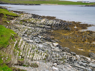 Eroded strata in sea cliffs on the west coast of Kettla Ness off the west coast of Mainland,...