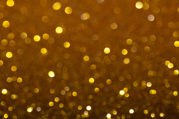 Fototapeta na wymiar blured golden glitter texture abstract background