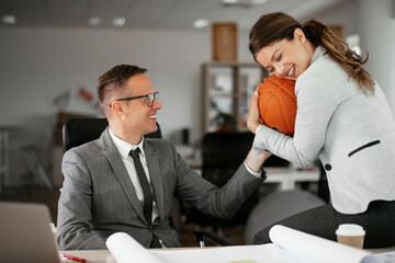 Colleagues in office. Businesswoman and businessman discussing work in office..