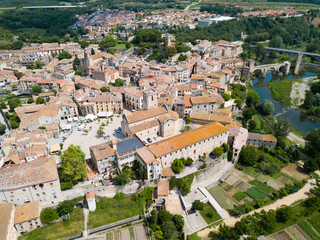 View from drone of medieval Spain town of Besalu with Romanesque bridge over Fluvia river