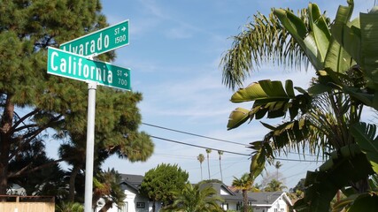 California street road sign on crossroad. Lettering on intersection signpost, symbol of summertime travel and vacations. USA tourist destination. Text on nameboard in city near Los Angeles, route 101