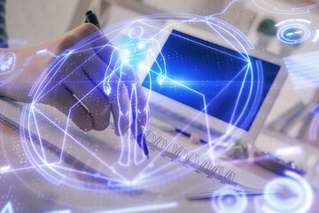 Education theme hologram over woman's hands writing background. Concept of study. Double exposure