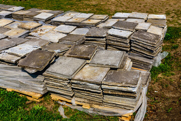 Grey pavement slabs stacked at the construction site