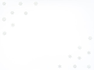 Christmas or winter white background with small white wooden snowflakes. New Year greeting card. Christmas, New Year or winter concept. Flat lay style with copy space.