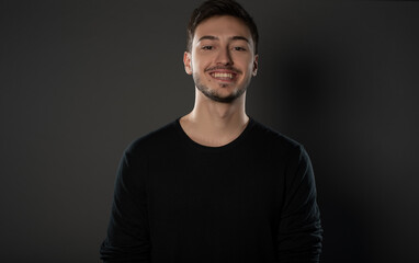 Fototapeta premium Portrait of an actor boy posing in studio on grey background. Isolated