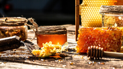 Sweet honey, pieces of combs and honey dipper. Honey dripping from honey dipper. Honey, Honeycomb,...