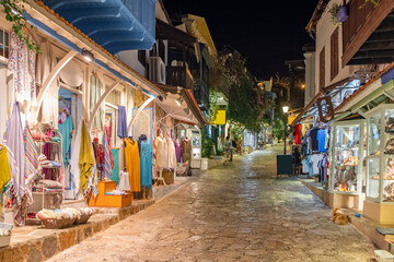 Obraz premium Street view in the Kas old town with boutique shops at evening, Turkey
