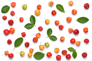 Flat lay pattern of fresh Acerola cherry with green leaves on white background, Top view