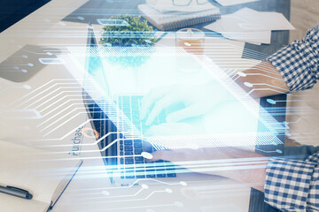 Multi exposure of tech drawings with man working on computer background. Concept of innovation.