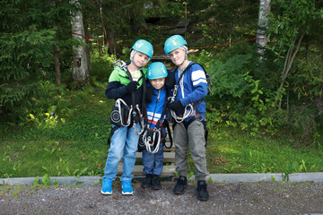 Children with climbing equipment in park