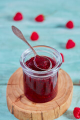 raspberry jam on wooden surface