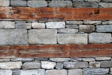 Mixed abstract background texture of wood and masonry wall.